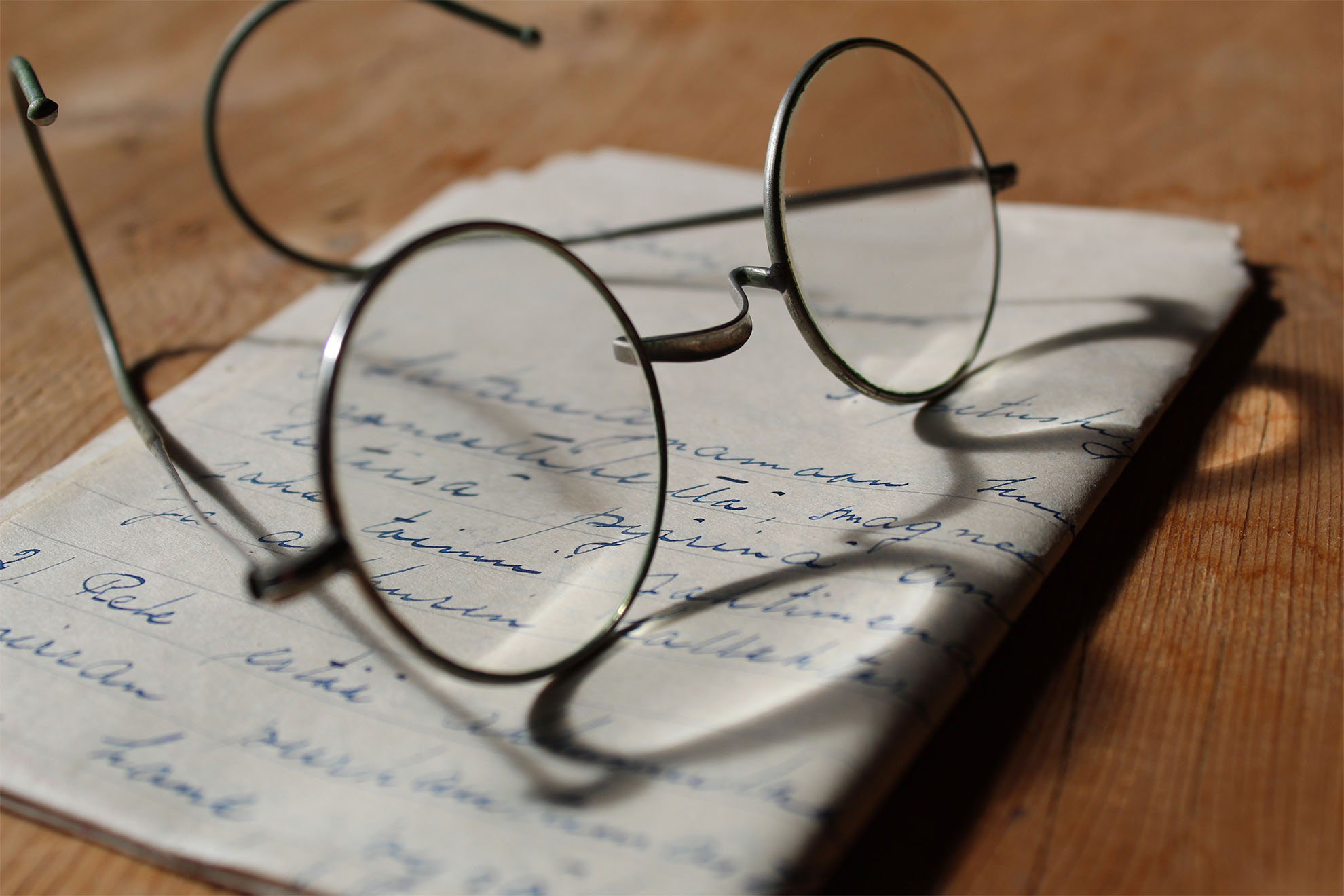 glasses on top of a note book