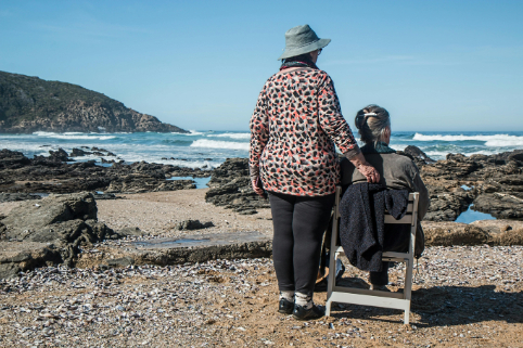 Older couple looking at sea