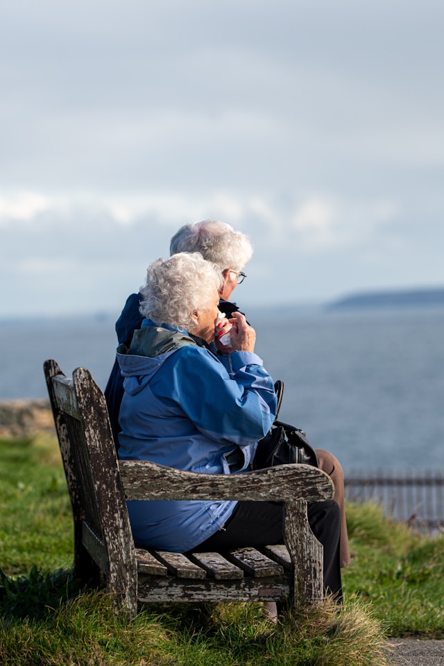 two residents sat outside enjoying the views